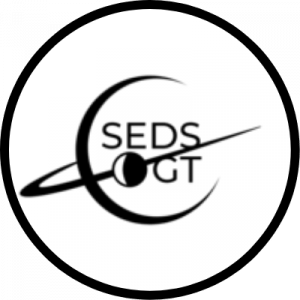 SEDS GT Logo, a white circle with the letters S E D S G T inside of the black outline of a planet with a ring.