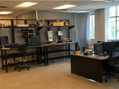 Image of a lab with tables and shelves